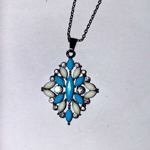 Turquoise and Ivory pendant necklace. Gunmetal chain. Lobster clasp. NWT.
